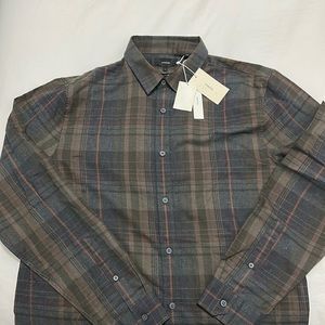 Vince butting down shirt